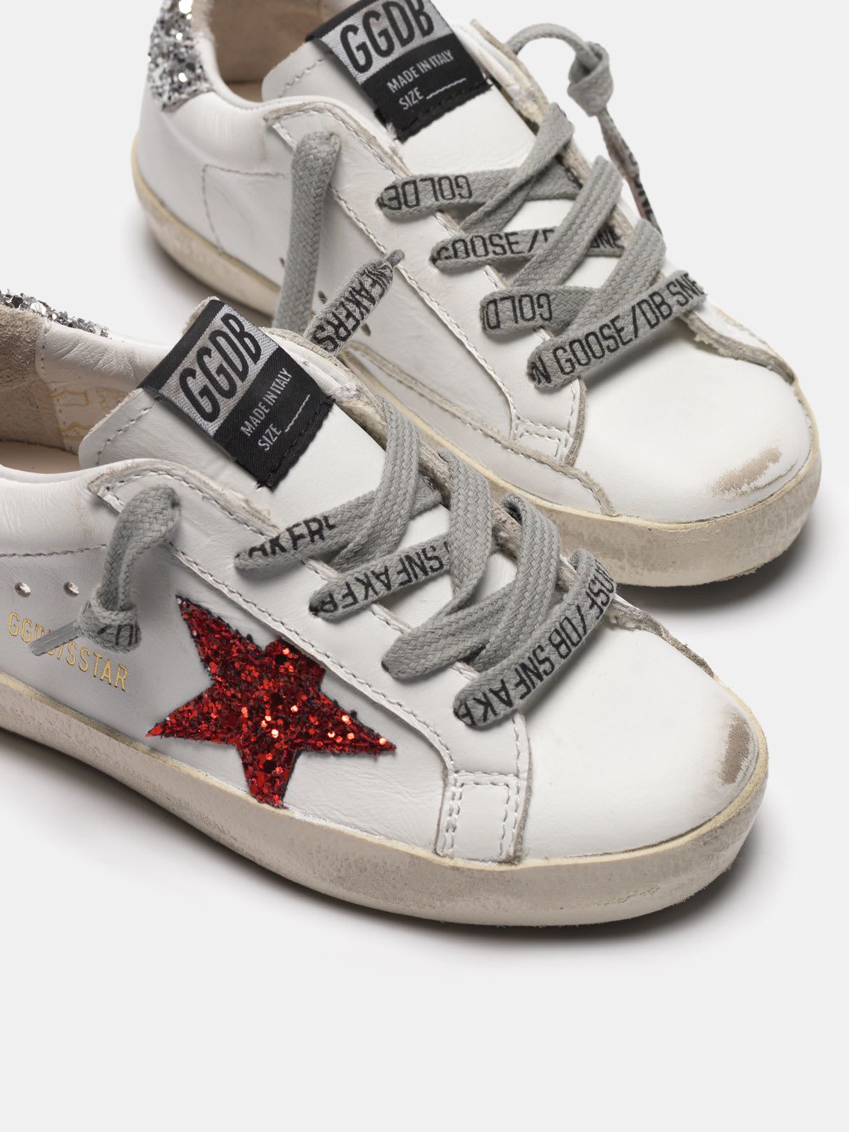 Superstar sneakers with glittery red star and glittery silver heel tab
